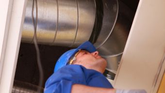 Contractor Performing Commercial Heating Service in Downtown Raleigh, NC