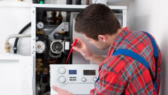 Technician Performing a Water Heater Replacement in Holly Springs, NC